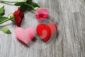 heart and rose flower pink and rose on wood background. concept valentine