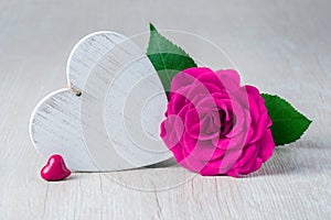 Heart and Rose Flowers on rustic table - Valentine Concept