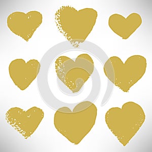 Set of cute gold hearts. Grunge hearts of different shapes