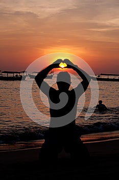 Heart shape on the baech at sunset