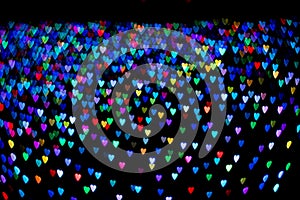 Heart shape bokeh on black abstract background