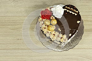 Heart shape Cake for mama. Happy mother`s day background with cake and chocolate