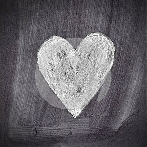 Heart shape chalk drawing on chalkboard blackboard