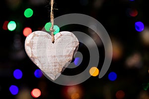 Heart shape of Christmas ornaments hanging on Christmas tree