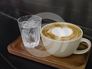 Heart shape of coffee art cup with dark background