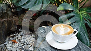 Heart shape coffee late on the stoney table. Nature background For coffee lover. Copy-space