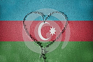 Heart shape drawning on sand with blending Azerbaijan flag