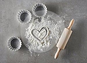 Heart shape in flour and baking equipment