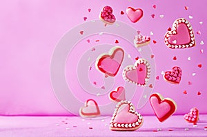 Heart shape flying sugar cookies with pink glaze for Valentine`s