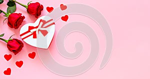 Heart shape gift box with red ribbon and roses, concept of Valentine`s, anniversary, mother`s day and birthday greeting, copy