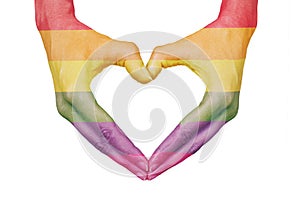 Heart shape with hands and LGBTQ+ flag