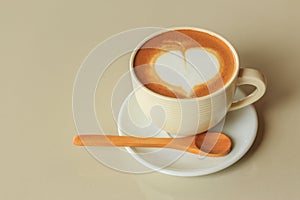 Heart shape in hot cappuccino coffee cup