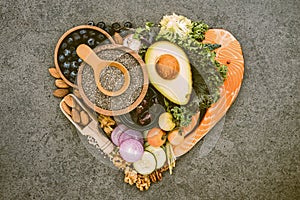 Heart shape of ketogenic low carbs diet, healthy unsaturated fat ingredients on dark  background