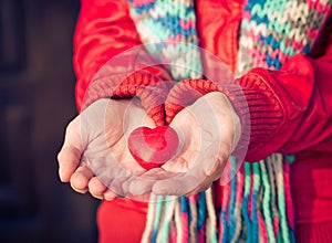 Heart shape love symbol in woman hands Valentines Day