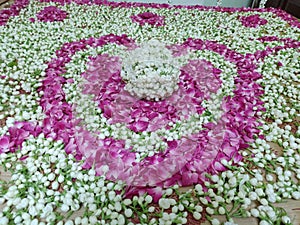 Heart shape made with jasmine and rose petals combination