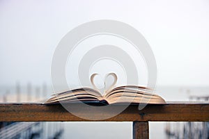 Heart shape made of open book pages