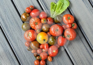 Heart shape made from a variety of tomatoes