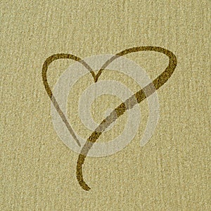 Heart shape on the sand surface