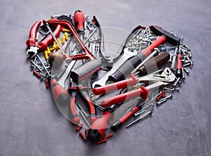Heart shaped arrangement of assorted hand tools