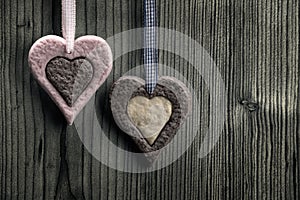 Heart-shaped biscuits with two colors - wood background