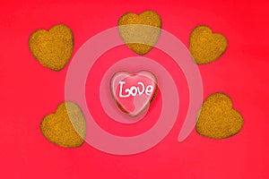 Heart-shaped biscuits for Valentine`s Day. Gingerbread Valentine on wooden background