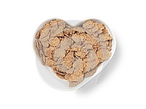 Heart shaped bowl bran cereal - Stock Image