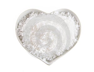 Heart shaped bowl of Flor de Sal photo