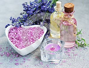 Heart-shaped bowl with sea salt and fresh lavender flowers