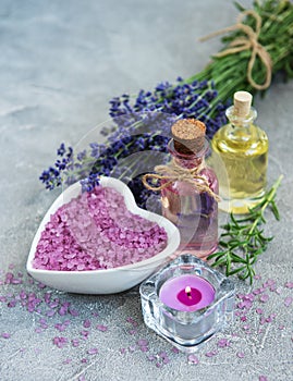 Heart-shaped bowl with sea salt and fresh lavender flowers