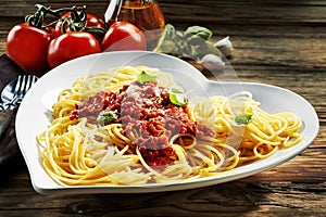 Heart-shaped bowl of spaghetti Bolognaise