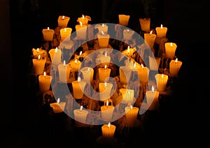 Heart shaped candelabra in Mexico with lighted candles photo