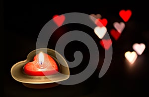 Heart-shaped candle for Valentines`s day