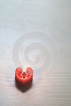 Heart-shaped candles emitting light