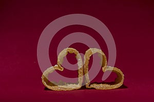 Heart shaped candy with red background