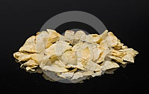 Heart shaped chip on top of chips pile. photo