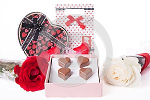 Heart Shaped Chocolate Love in pink gift box and Roses Valentines Day