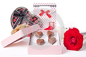 Heart Shaped Chocolate Love in pink gift box and Roses Valentines Day