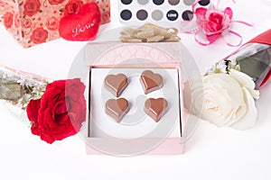 Heart Shaped Chocolate Love in pink gift box and Roses Valentines Day