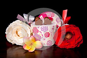 Heart Shaped Chocolate Love in rounded gift box with flower Valentines Day