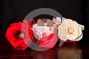 Heart Shaped Chocolate Love in rounded gift box with roses Valentines Day