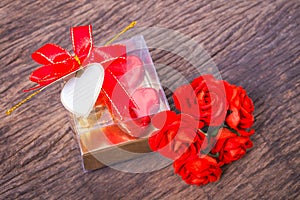 Heart shaped chocolates box with blank card and roses