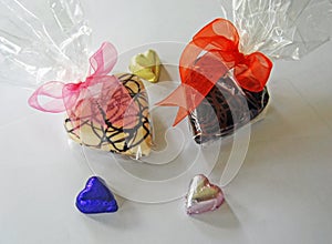 Heart shaped chocolates in cellophane and foil wrappers