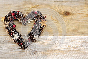 Heart shaped christmas decoration wooden background