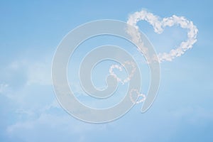 Heart shaped cloud in blue sky. Valentine and wedding background