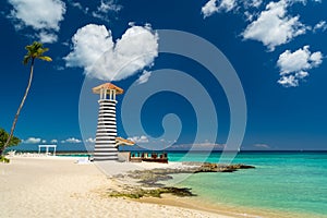 Heart shaped cloud over Lighthouse on the beach of the Caribbean, Dominican Republic, Bayahibe - Love Wedding Concept
