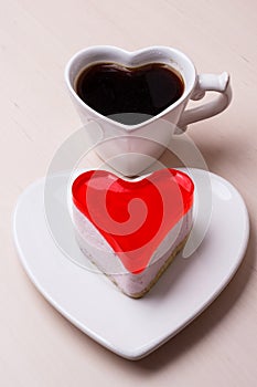 Heart shaped coffee cup and cake
