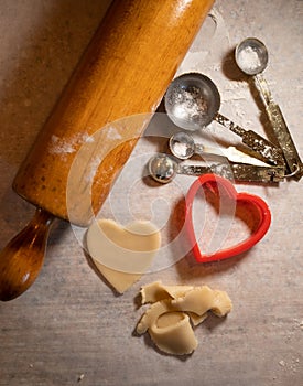 Heart Shaped Cookie Cutter with Cookie Dough and Baking Items