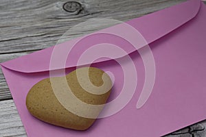 heart shaped cookie, purple envelopes on a wooden rustic background. Valentine's Day, greeting card, pastry, Copy space