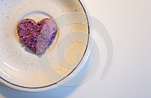 Heart shaped cookie spread with blueberry curd cream for Valentine\'s Day on plate