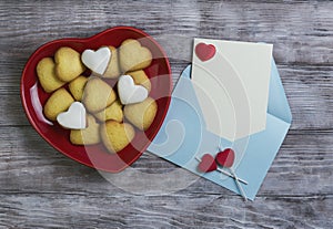 Heart shaped cookies and two candles